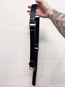 Repurposed Leather. Brass. 34-40”